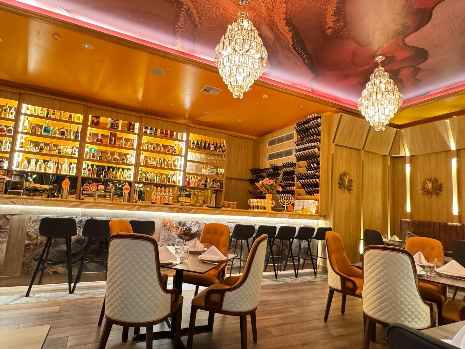 Twin crystal chandeliers above the main bar