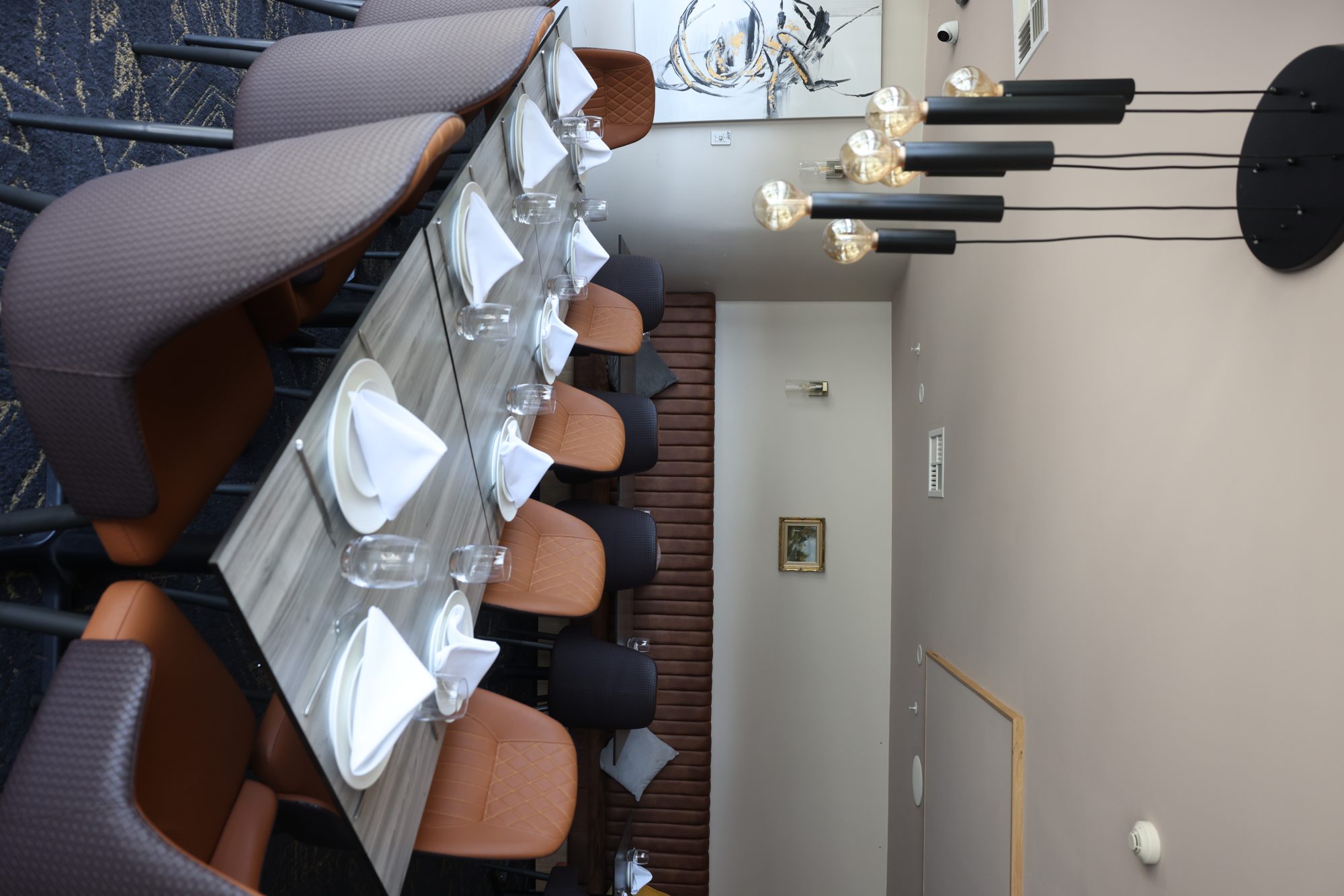 Private dining area under pendant cluster