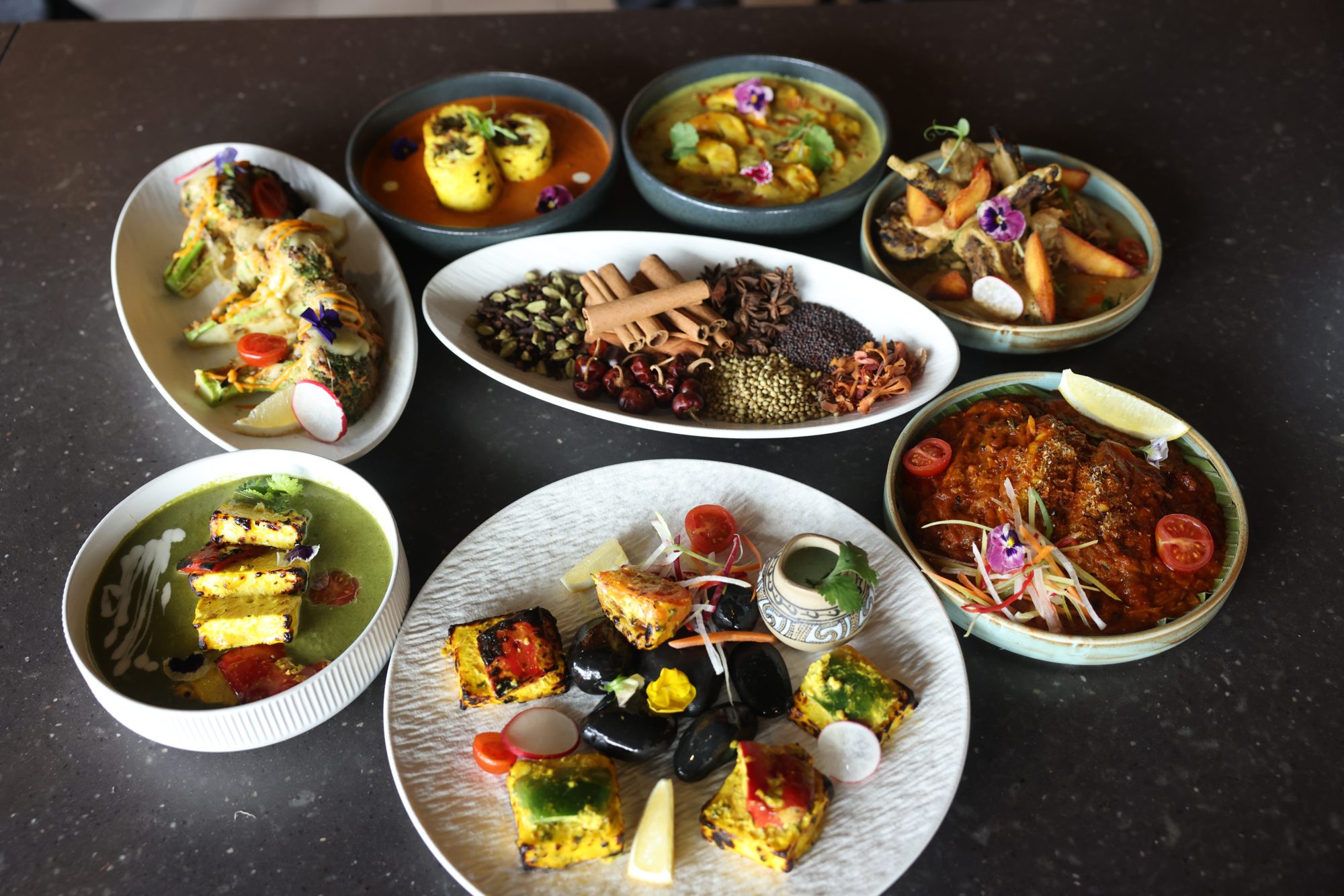 Overhead thali platter with curries and sides