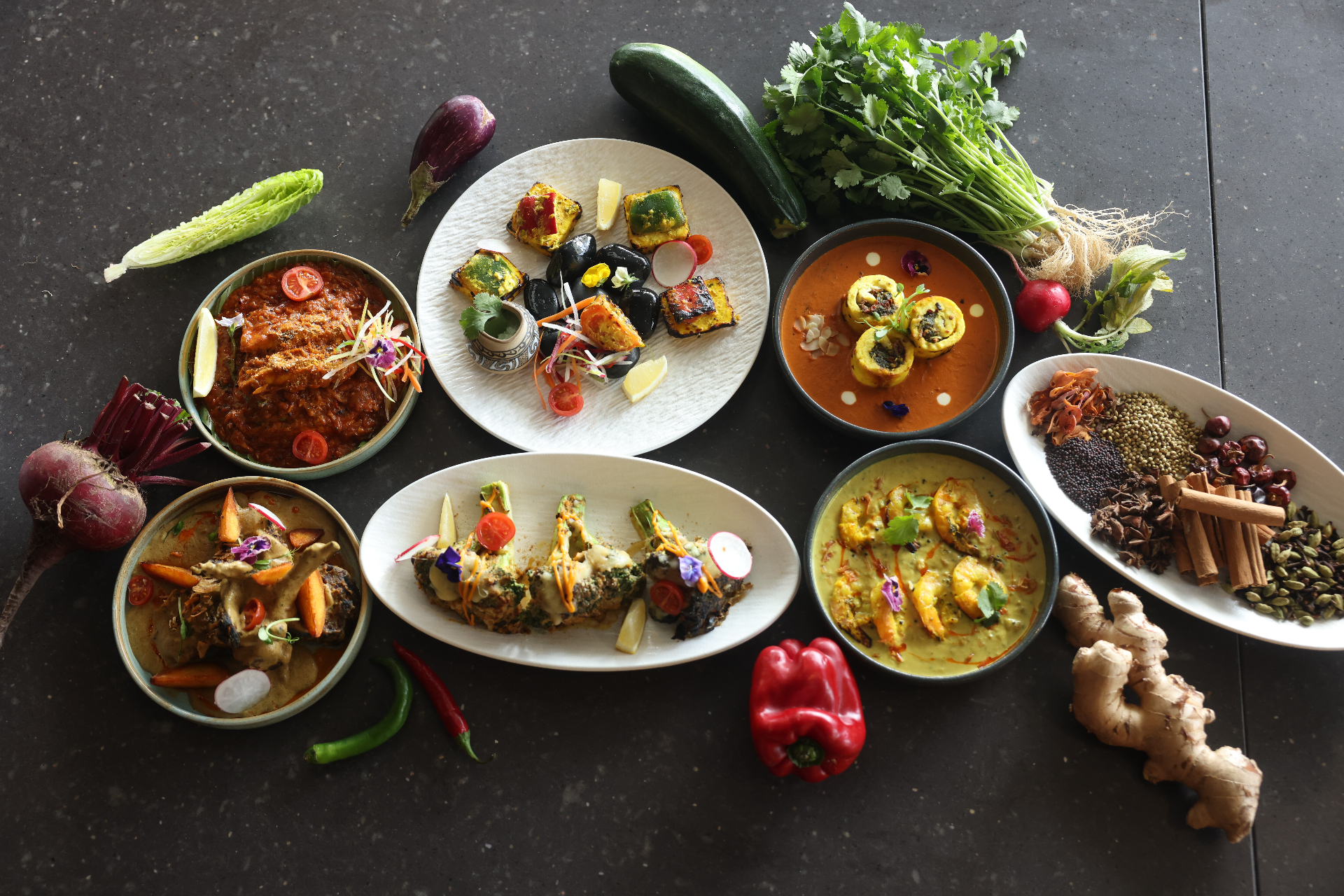 Overhead feast of Stonewater signature dishes and spices