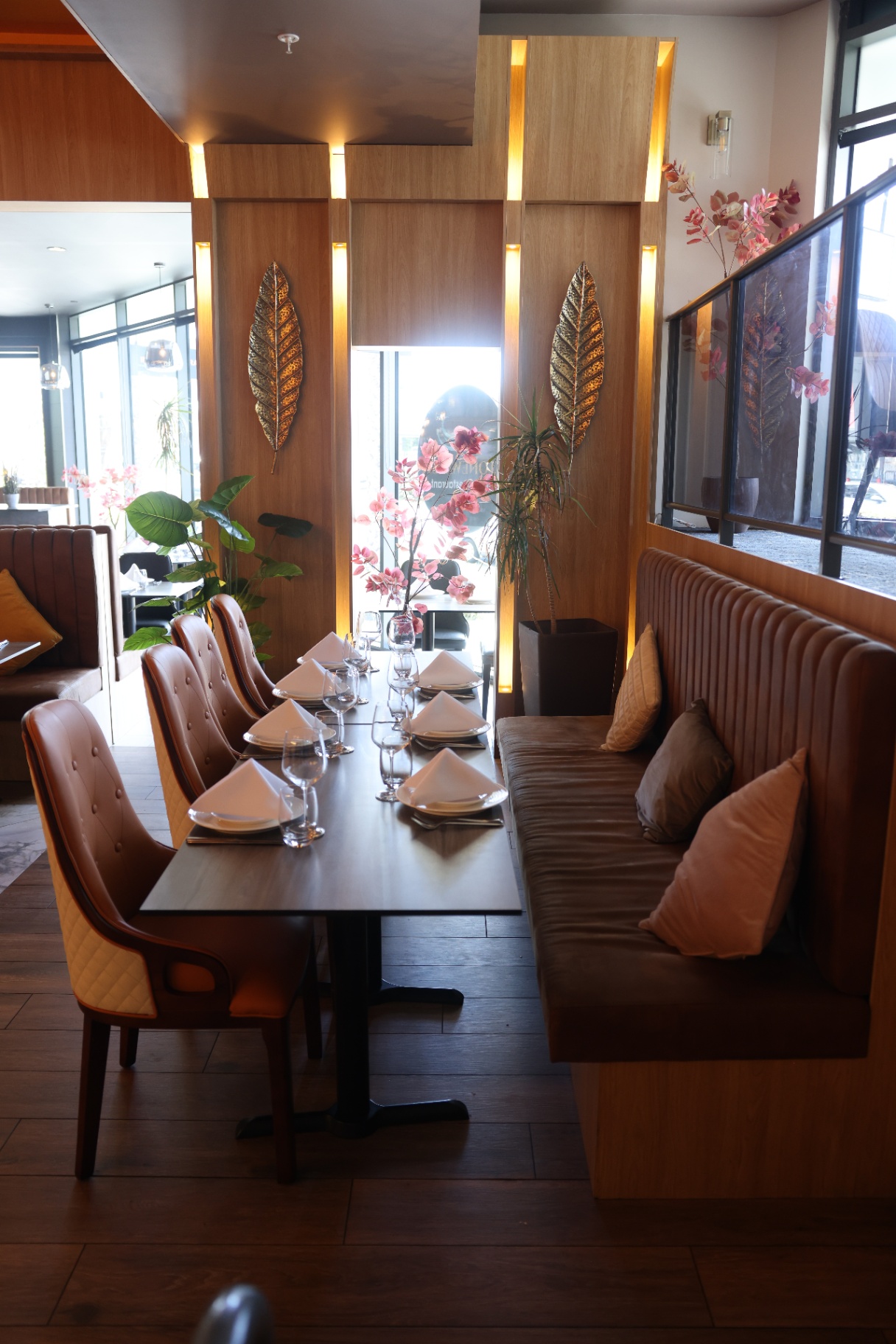 Banquette seating with gold leaf wall art