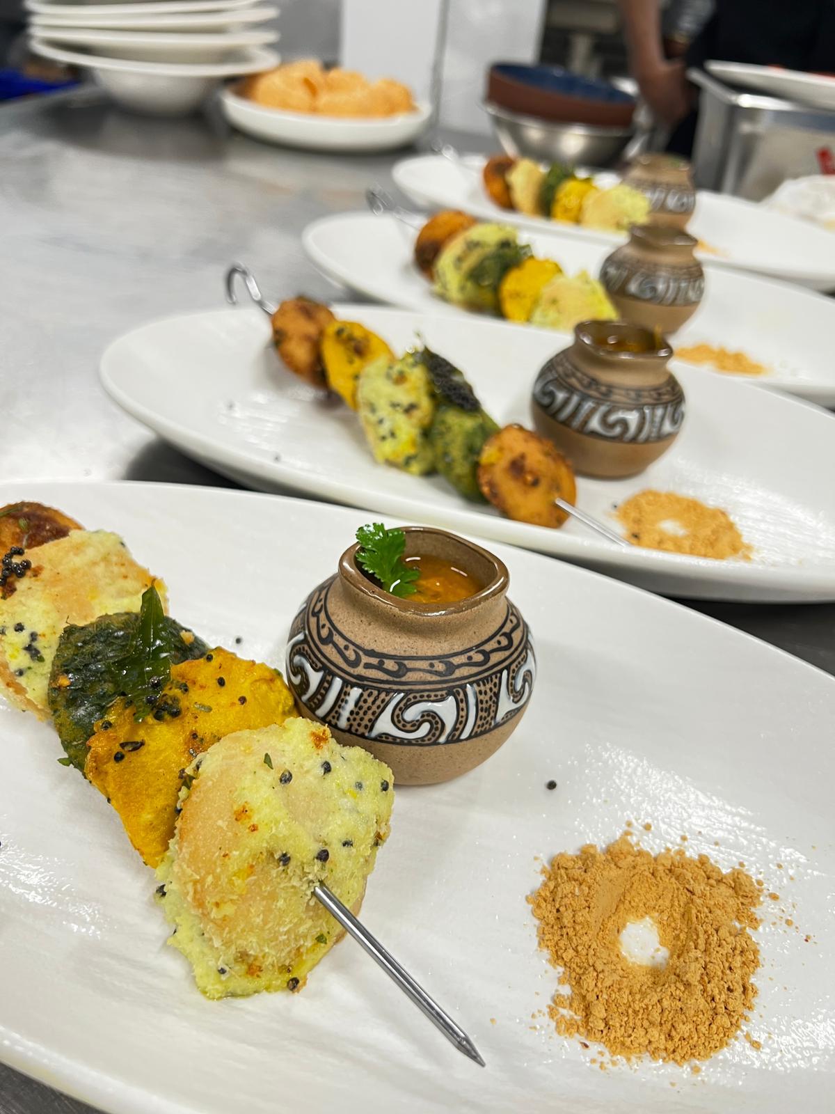 Chef plating — skewers with house chutney