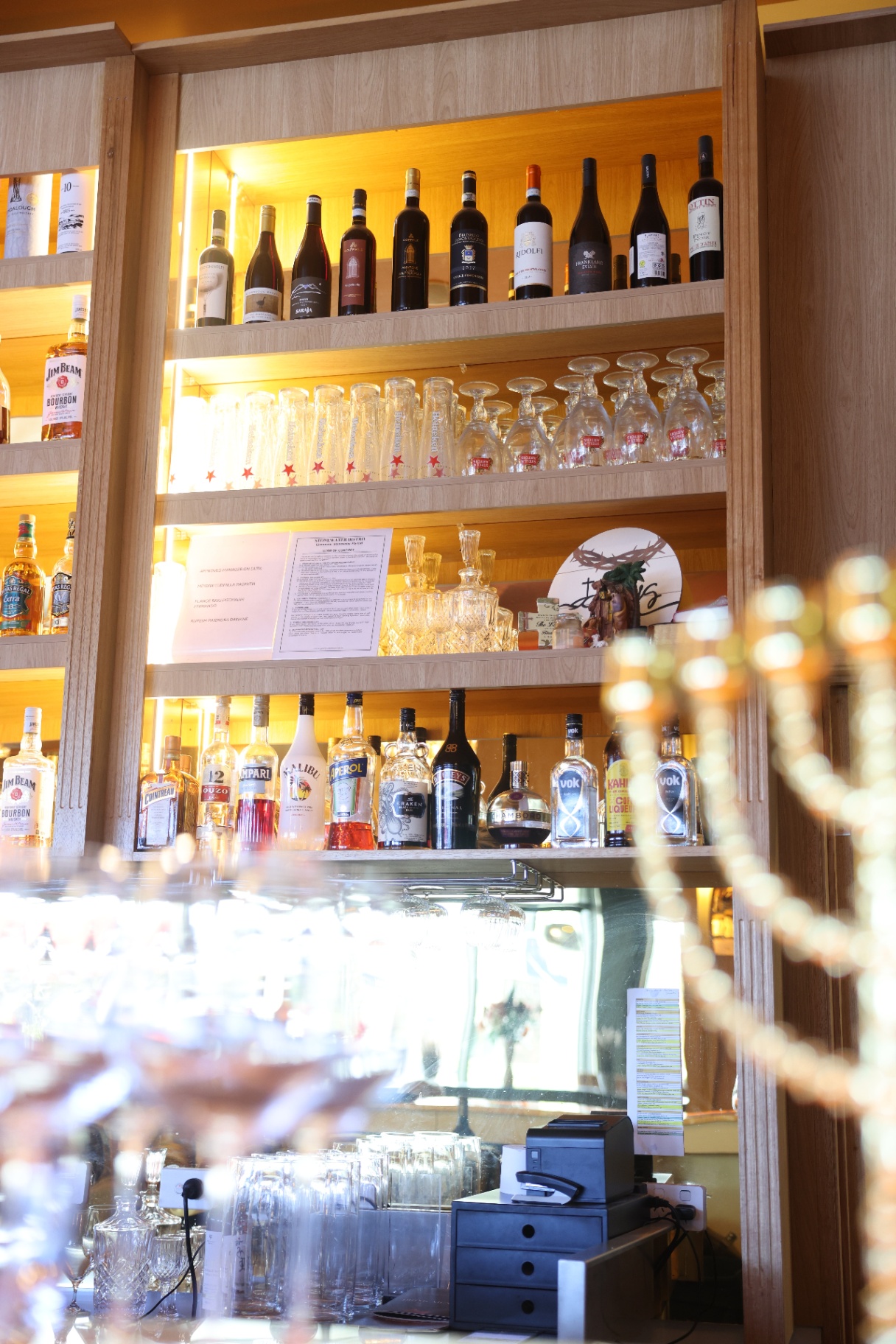 Back bar with wine, spirits and glassware