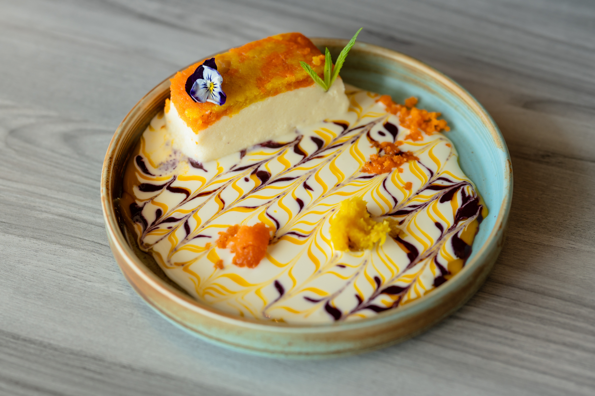 Mango dessert with marbled sauces