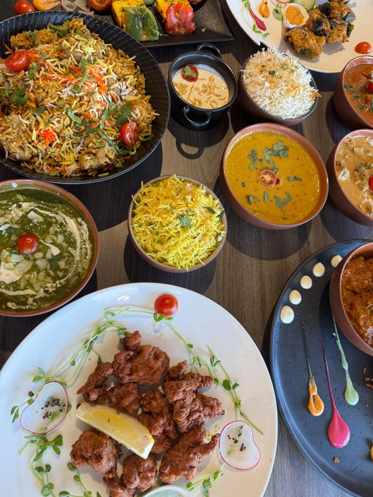Spice-led feast spread with biryani and curries
