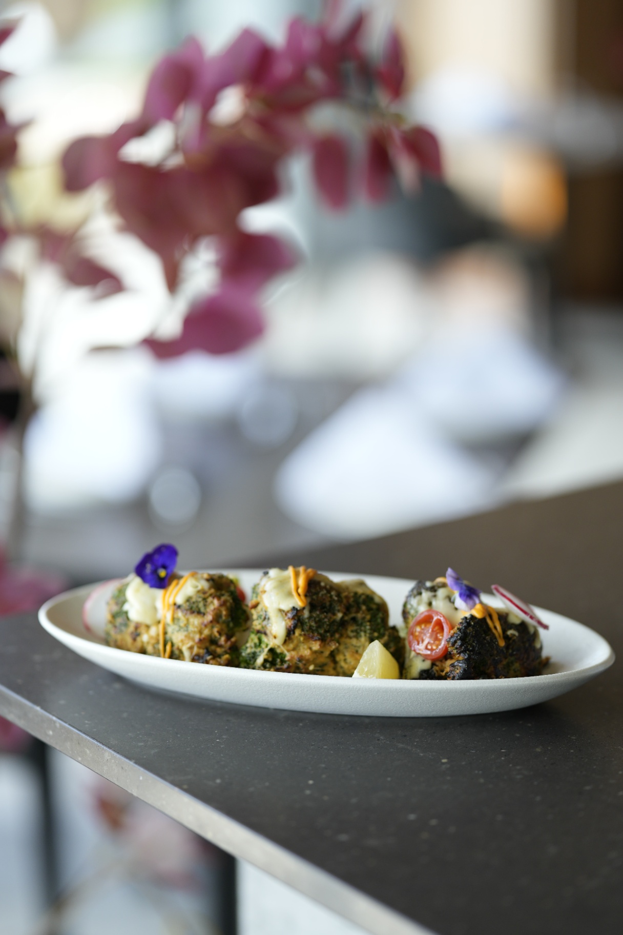 Broccoli malai kebab with floral backdrop