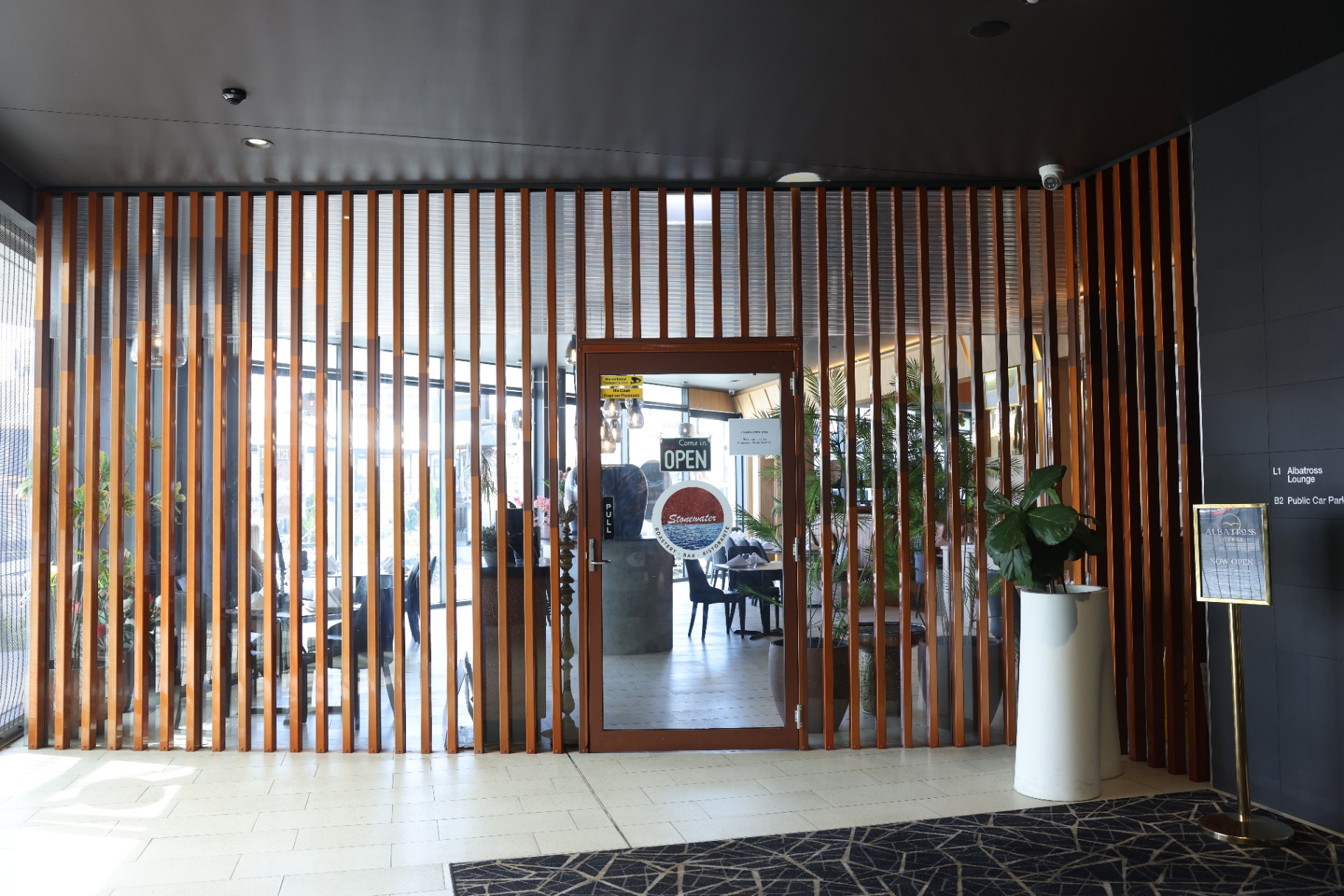Stonewater slatted timber entrance and signage